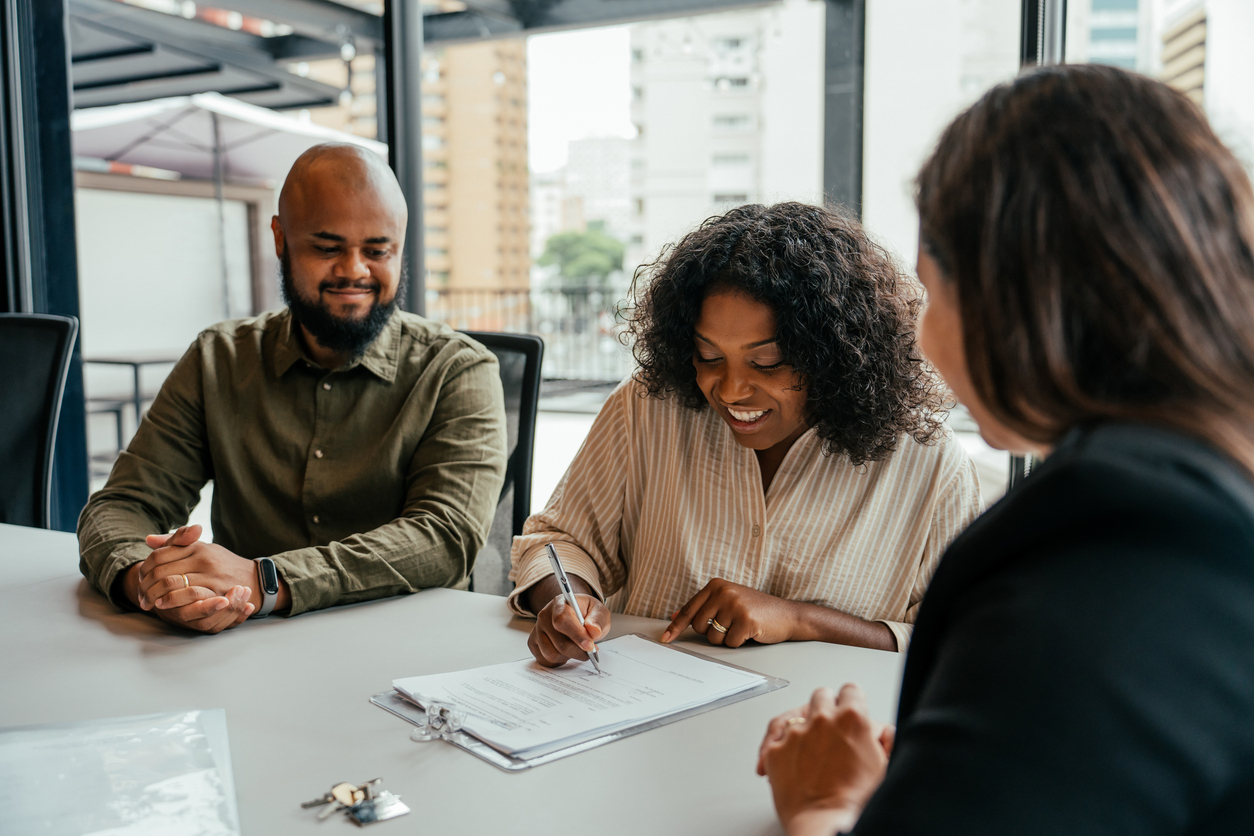 A client signing a document consenting to a fee division