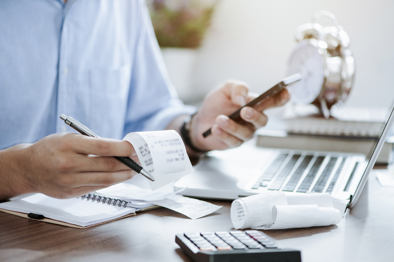 A calculator and documents representing a tax controversy matter